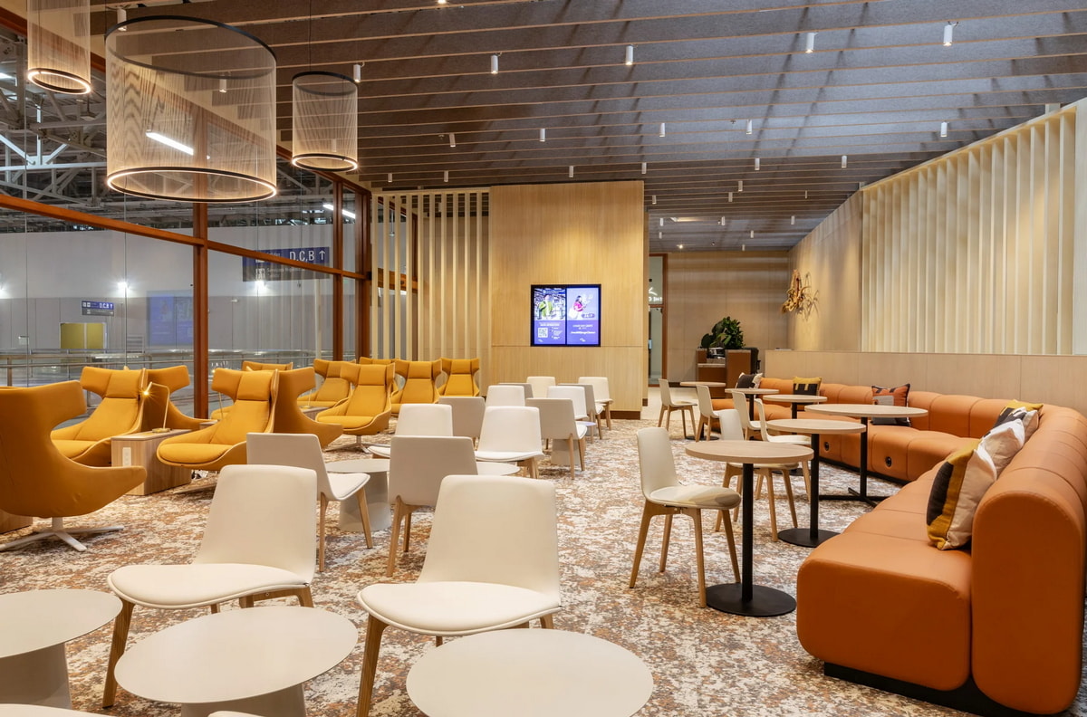 Seating and tables inside of lounge.