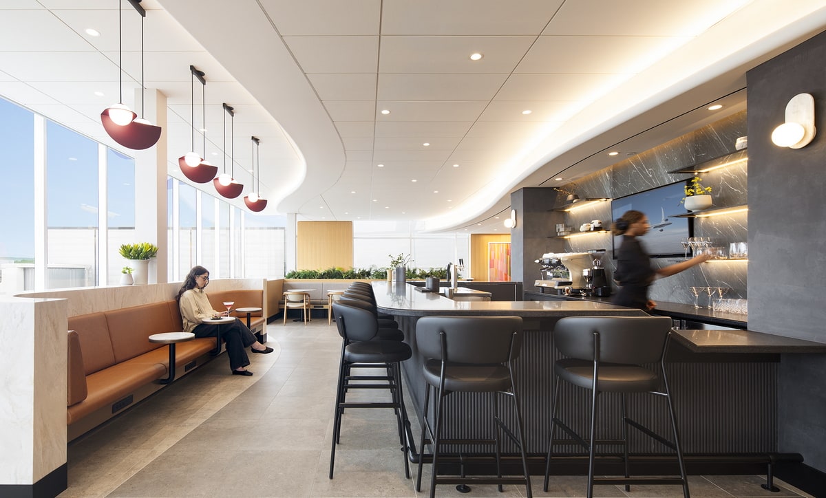 View inside the lounge with the bar and seating along the windows.