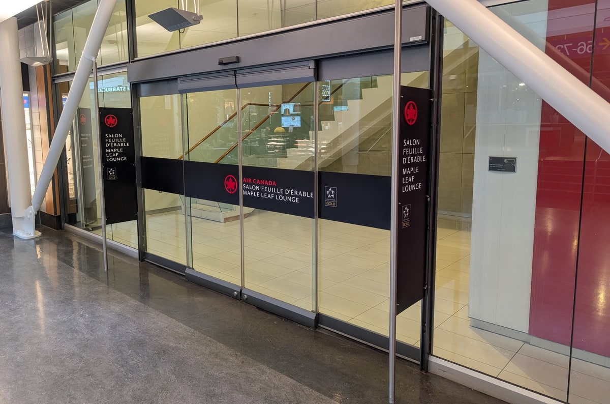 glass door entrance to the Air Canada Transborder Lounge in Montreal.