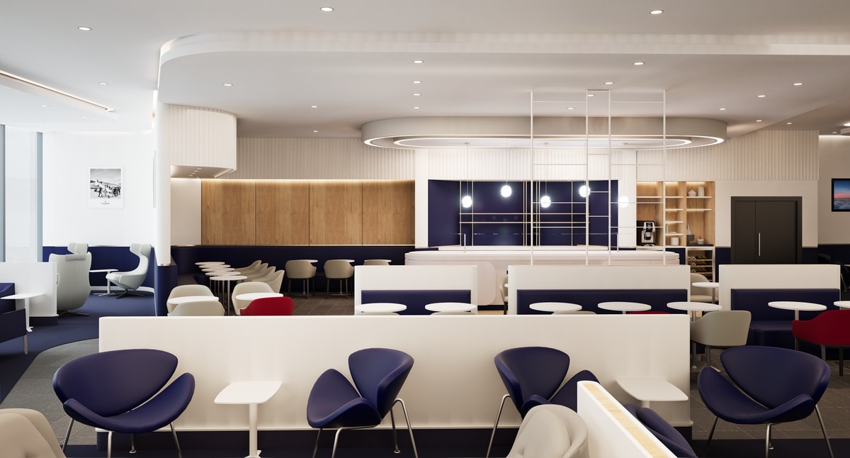 main dining area with tables, chairs, and kitchen area in the background.