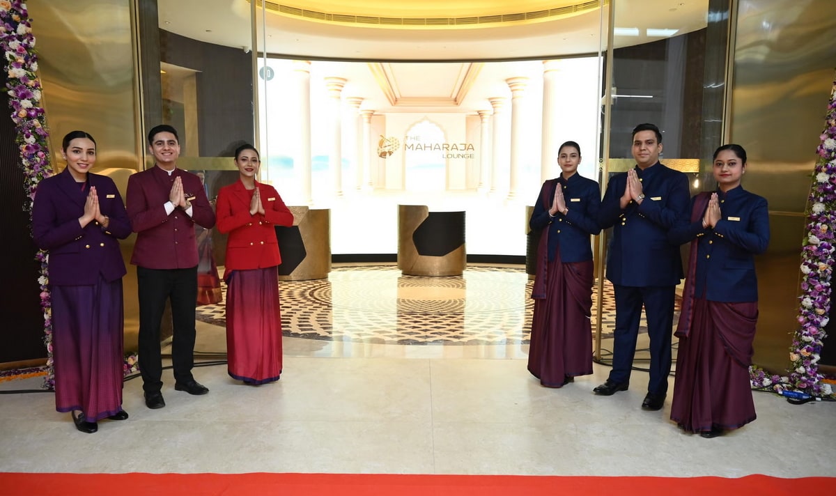 Entrance to the Air India lounge in Delhi, with people standing at the door.