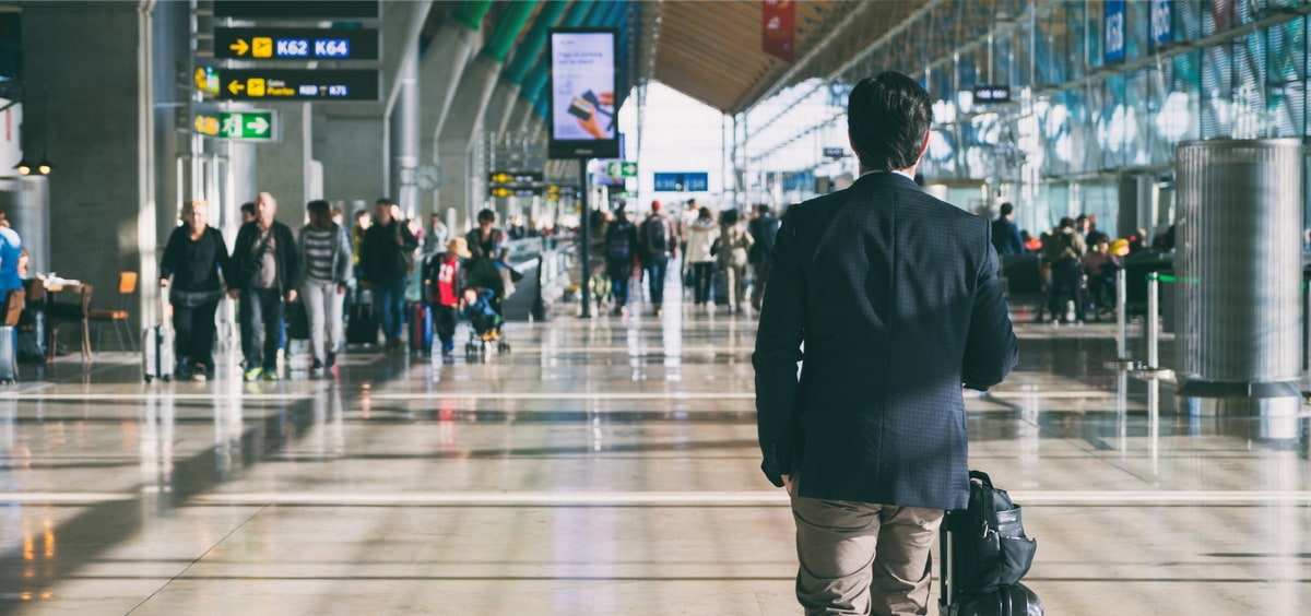 people walking in a terminal.