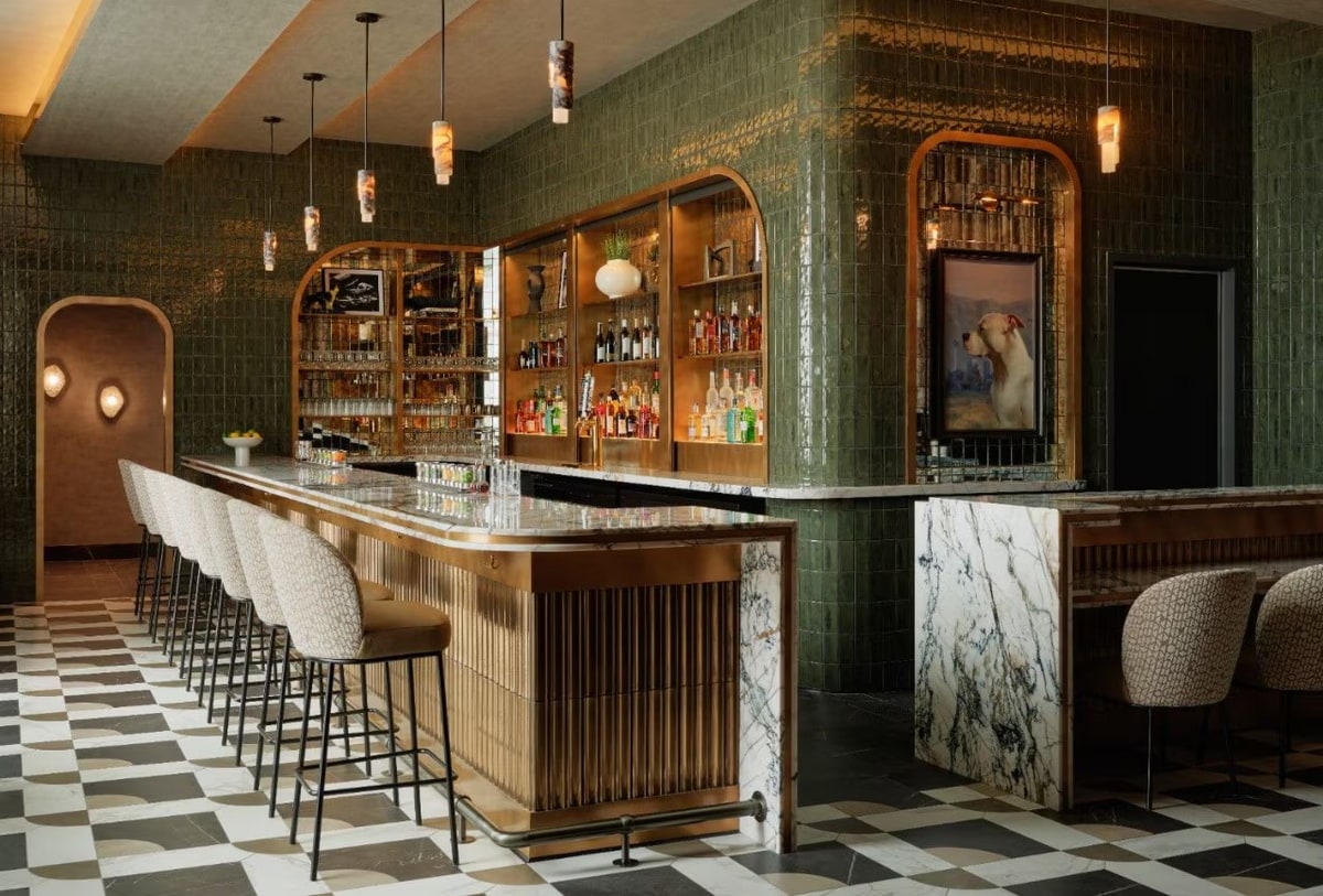 bar area inside the Sidecar lounge with steating and marbile tables.