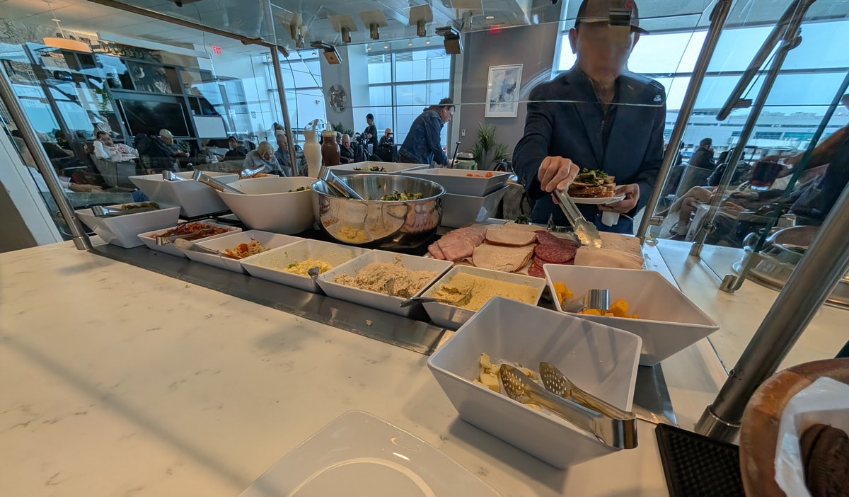 self-serve food buffet with various lunch items.