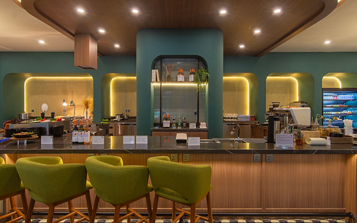 bar area with chairs and a marble countertop