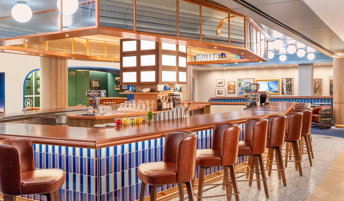 bar area with seating and views of the lounge.