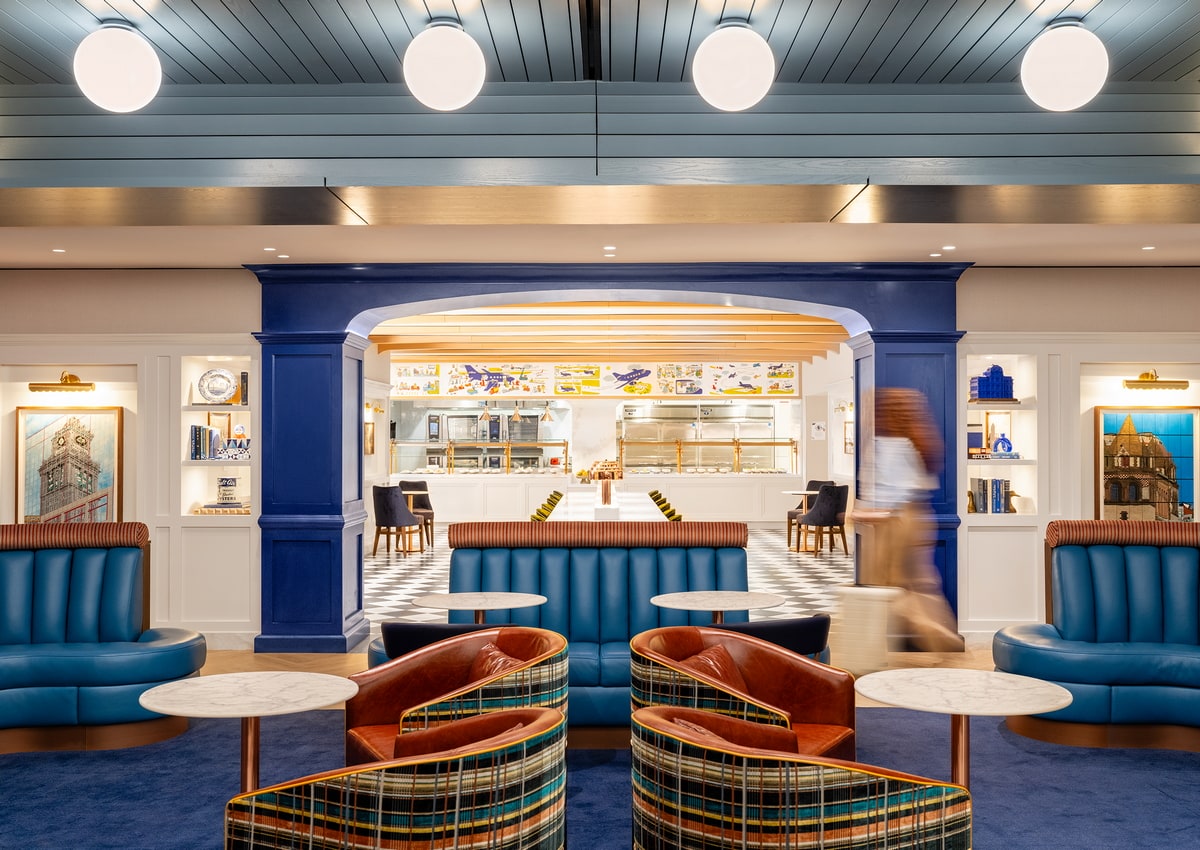 dining area with chairs, tables, and food.
