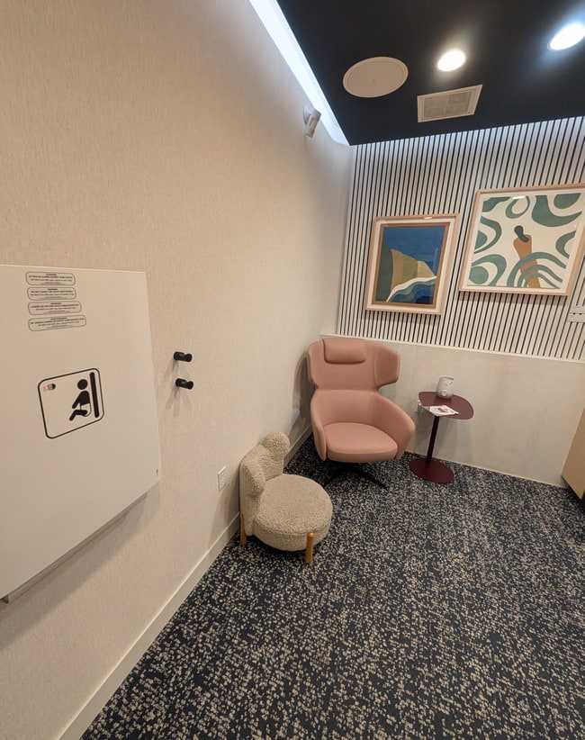 mothers room with a nursing chair, a kids chair, and small table.