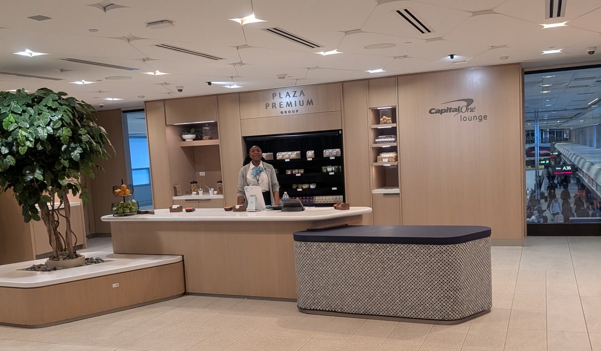 The main reception area with a person standing at the desk and grab-and-go food.