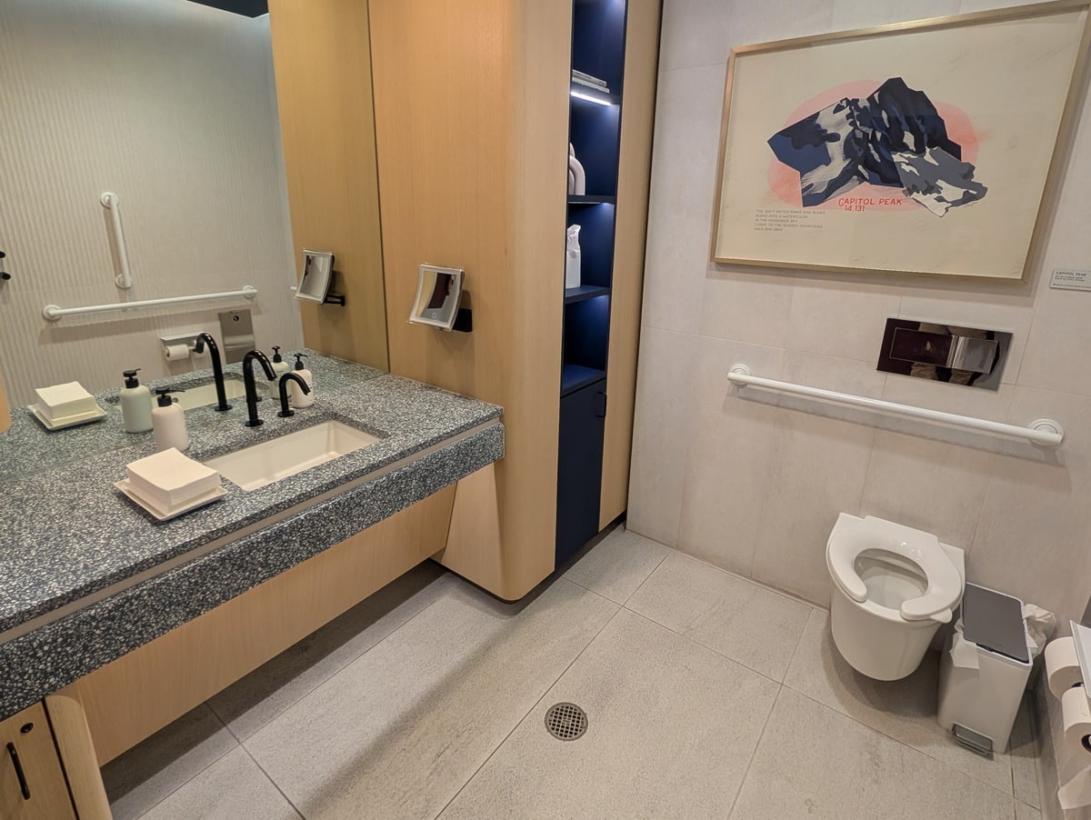 private restroom, with sink, and toilet.