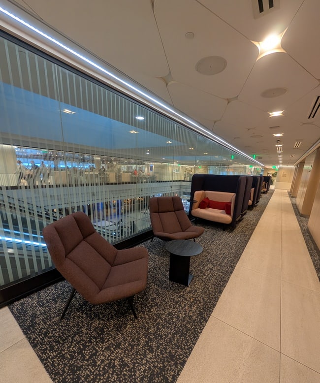 seating area with tables, charis and love seats.