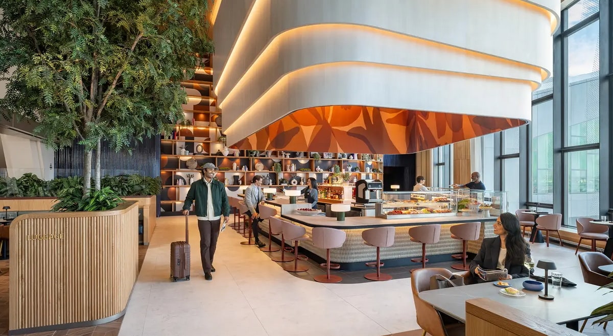 Lounge area showing the bar, large windows, and seating.