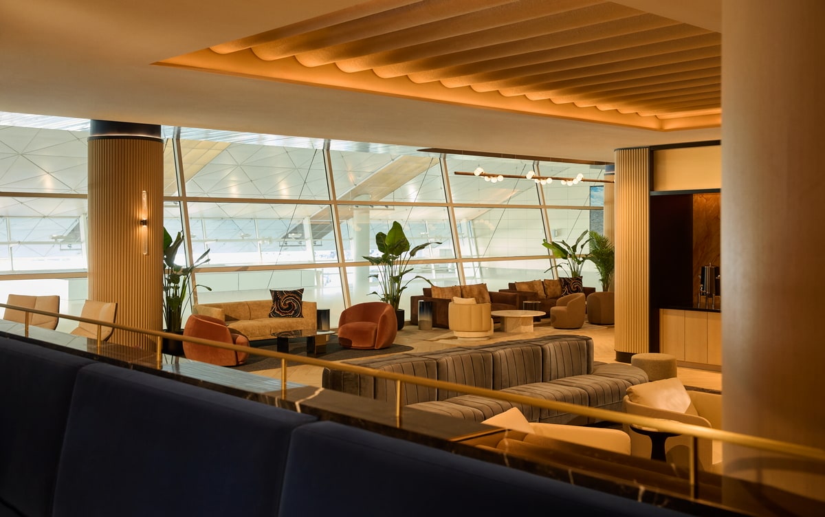 seating and tables, with large windows in the background.
