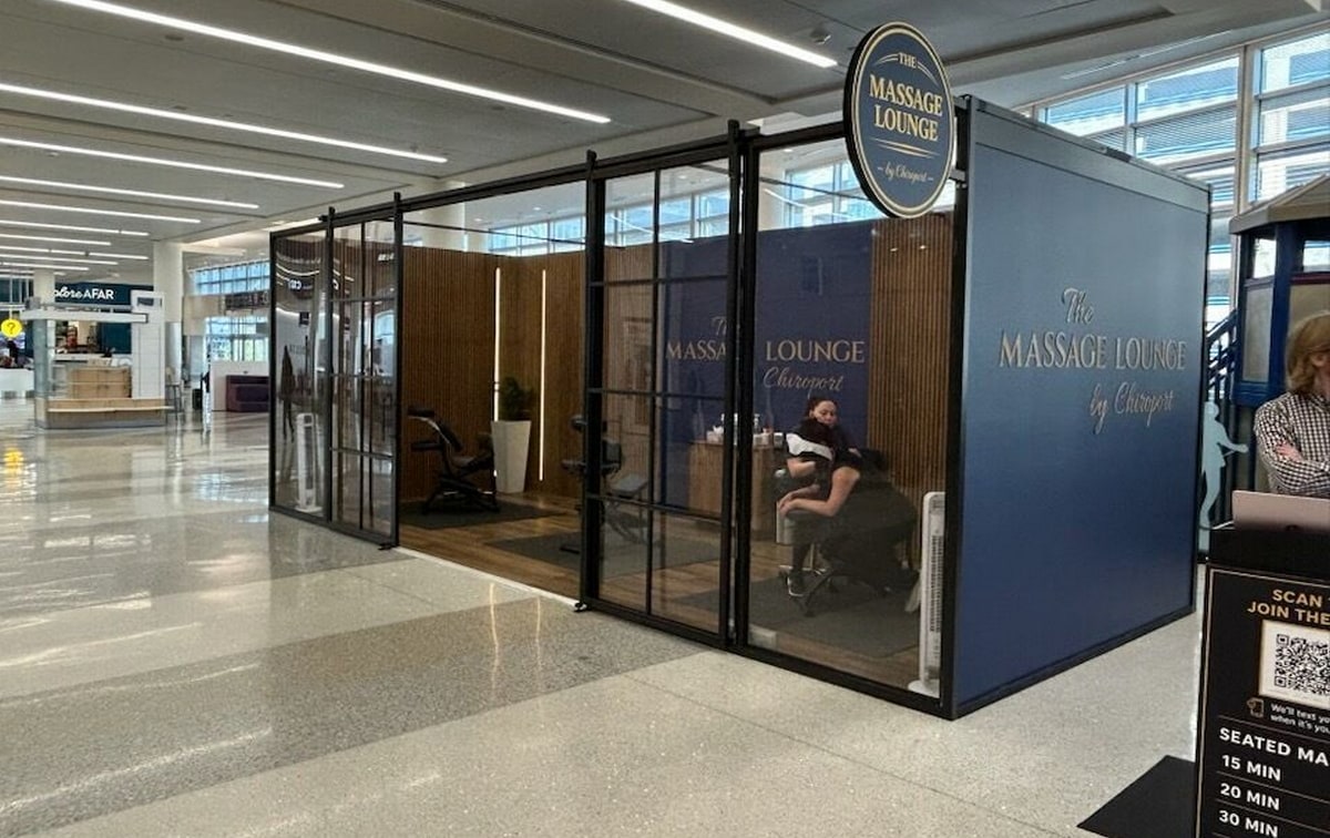 Entrance to The Massage Lounge at MSP with check-in desk and entrance.