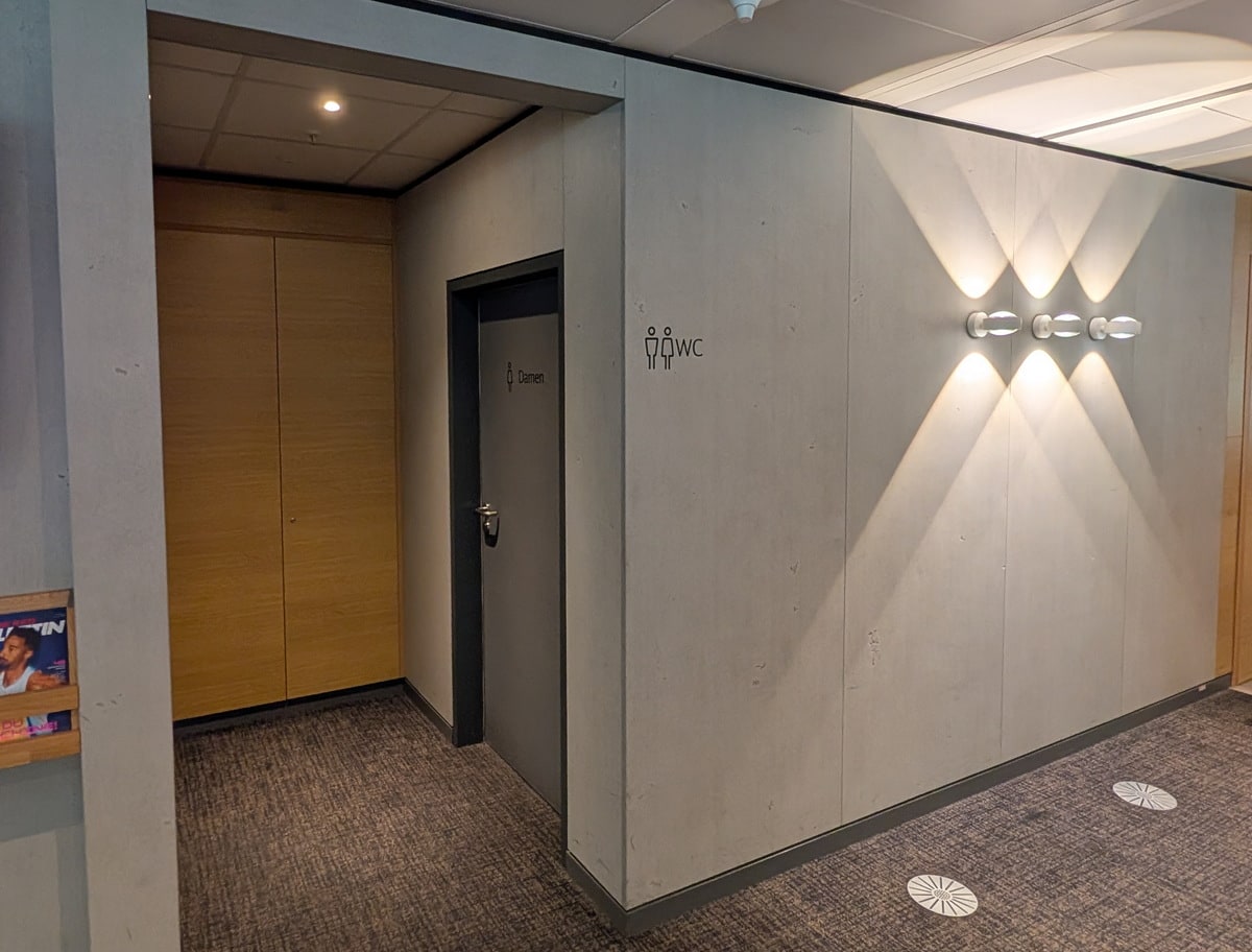 view outside the restroom from the hallway with two doors one for men and the other women.