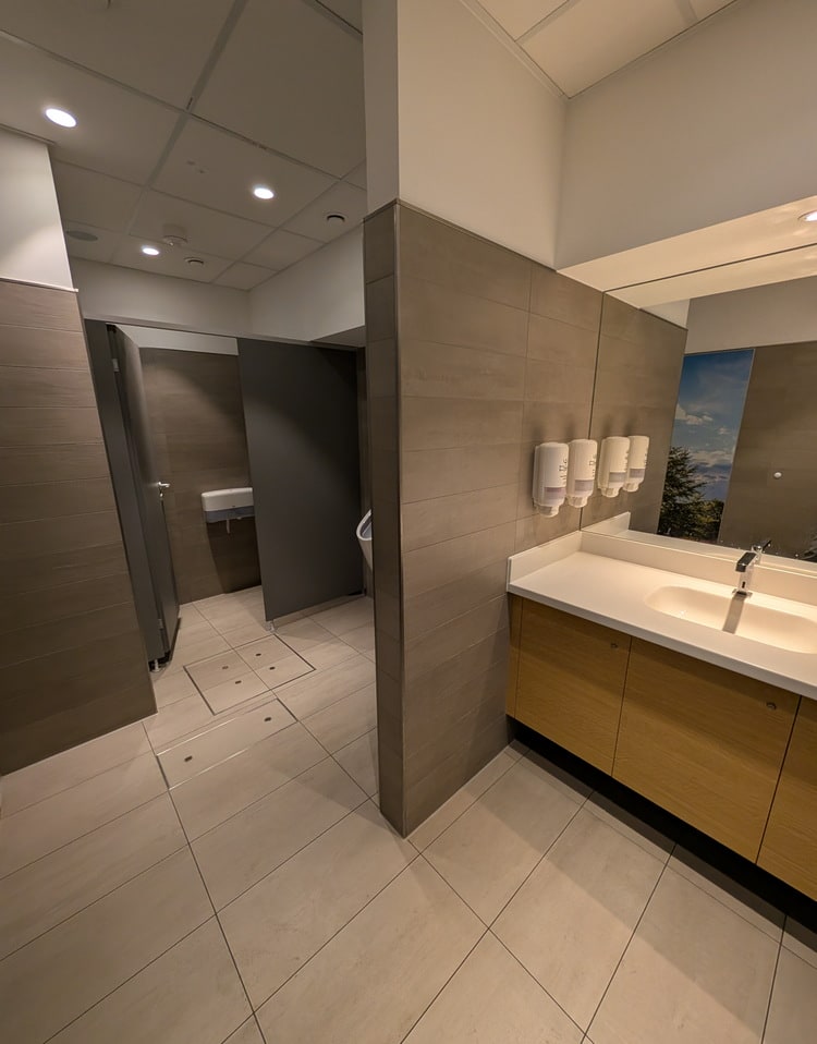 mens restroom, showing the toilet area enclosed in a private room.
