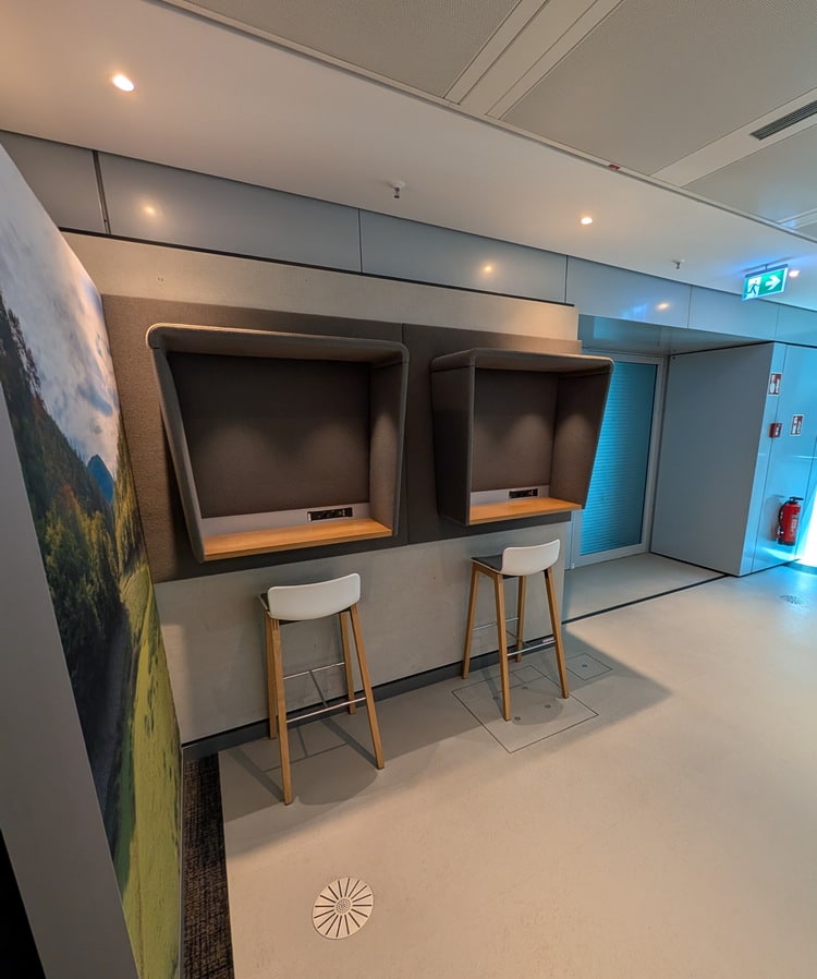 private work booths with high top bar stool.