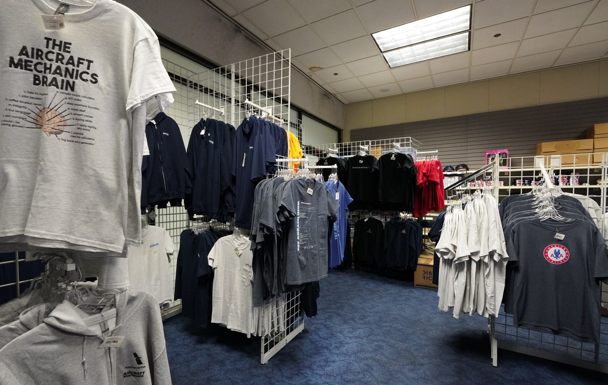 inside the store with aviation t-shirts hanging.