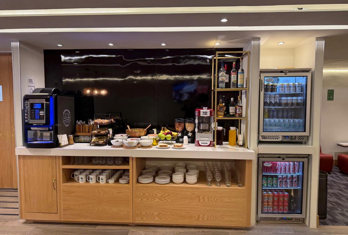 food and beverage area, with self-serve options and plates.