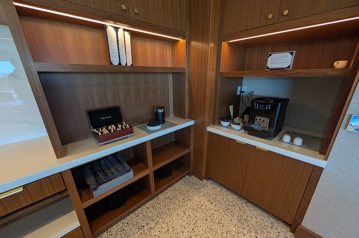 expresso machine and tea area with cups.