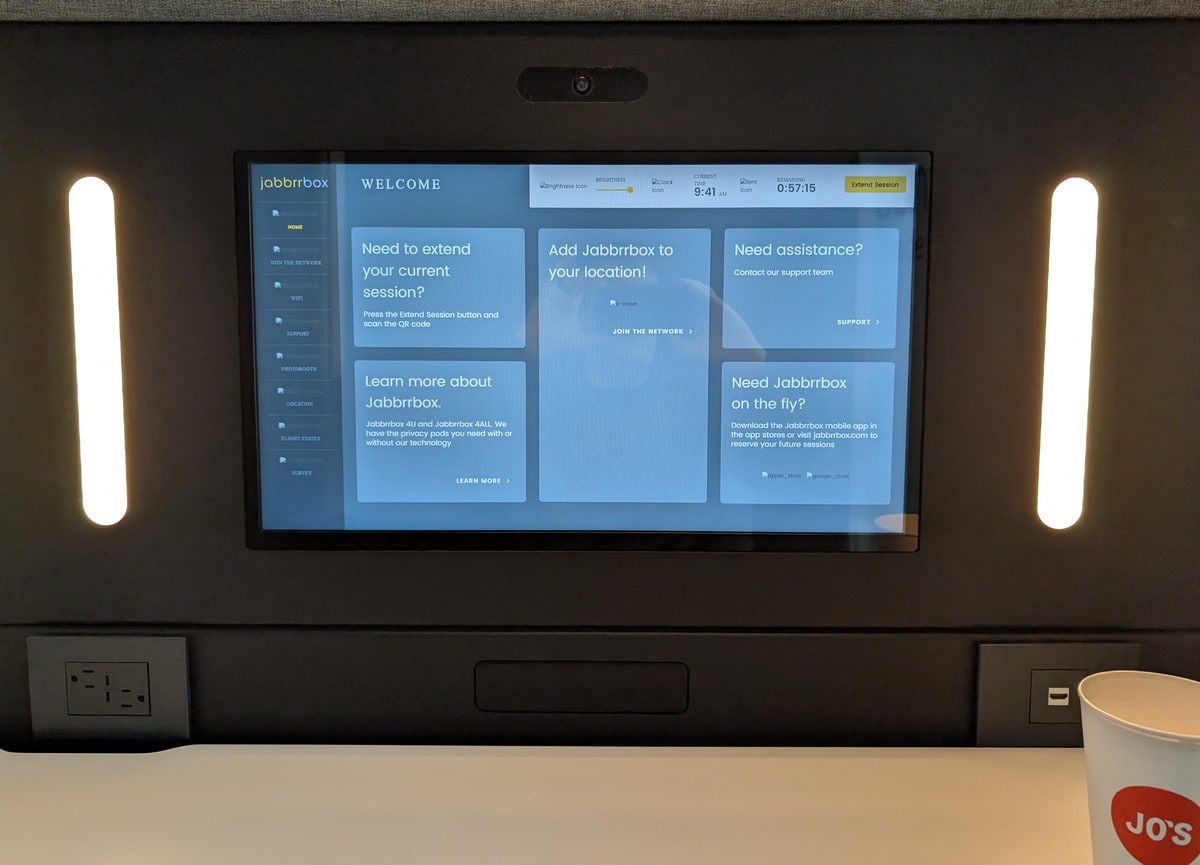touchscreen monitor in the middle of the pod, above the desk.