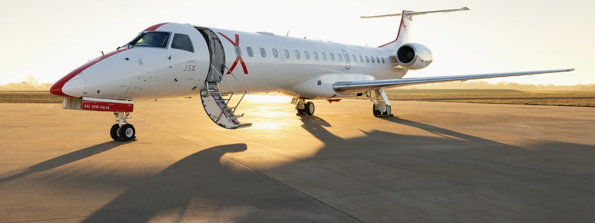 JSX Embraer ERJ-145LR plane sitting on ramp.