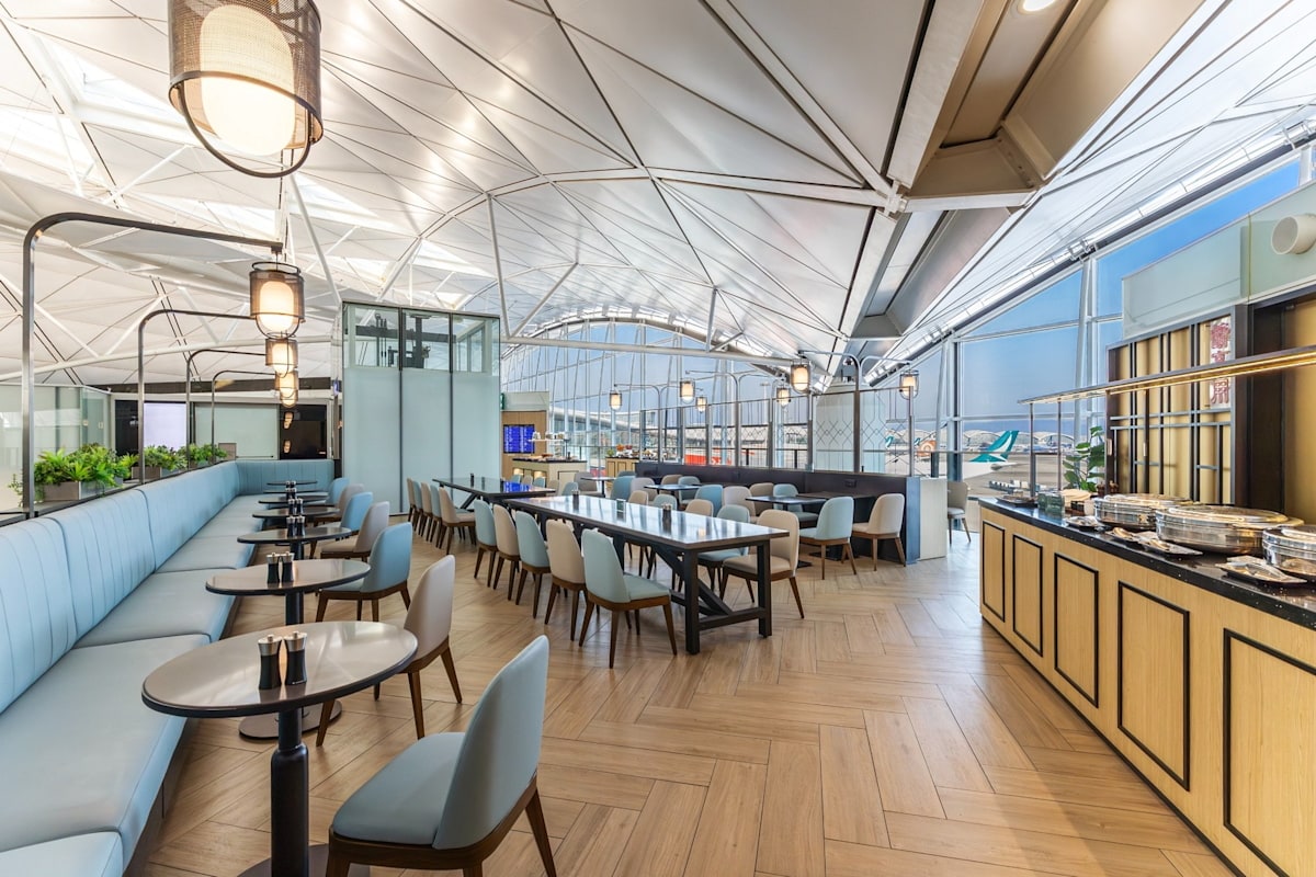 main seating area with tables and full-size windows in the background