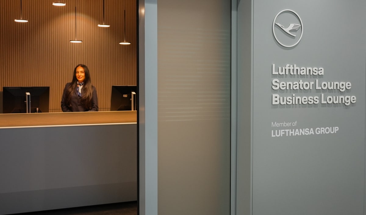 Outside view of the entrance to the Lounge with person waiting at the front desk.
