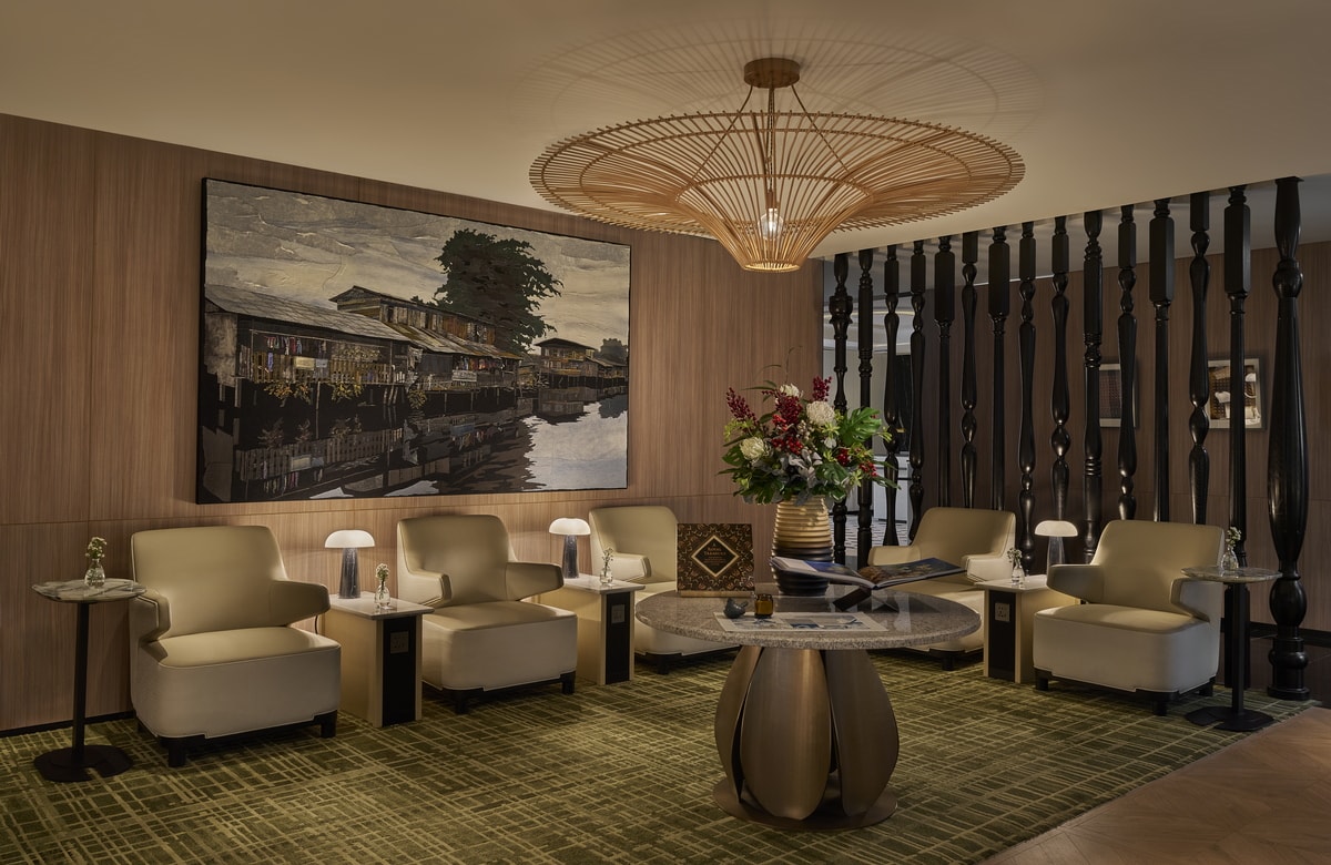 seating and relaxation area in the Plaza Premium Lounge, with chairs and side tables.