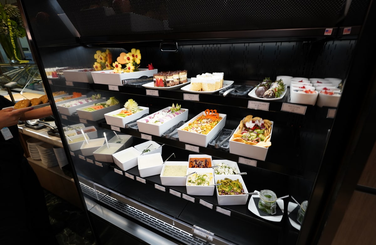 buffet area with fresh salad and other items.