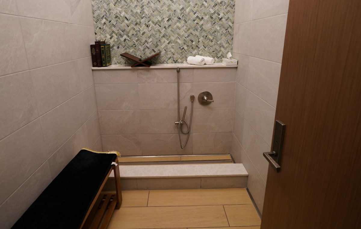 prayer room with bench and wudu area.