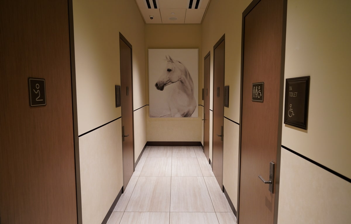hallway with restrooms, prayer room, and shower room.