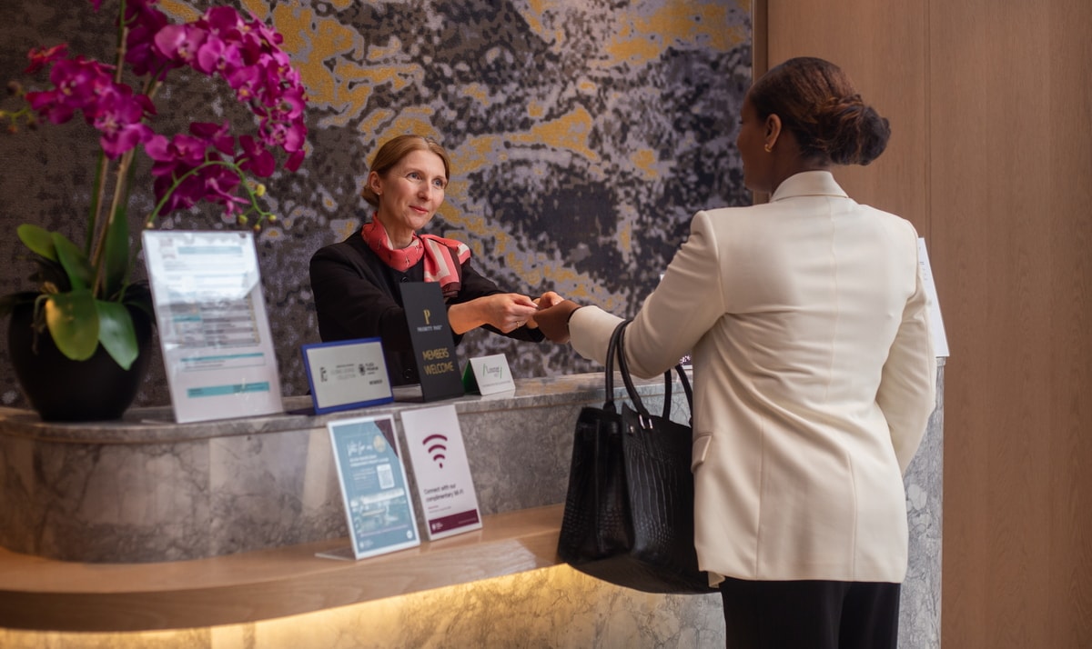 person checking in at the reception desk.