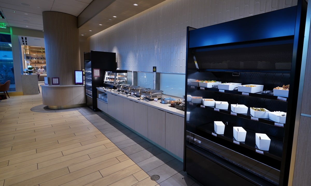 self-serve food buffet area with both warm and cold items to choose from.
