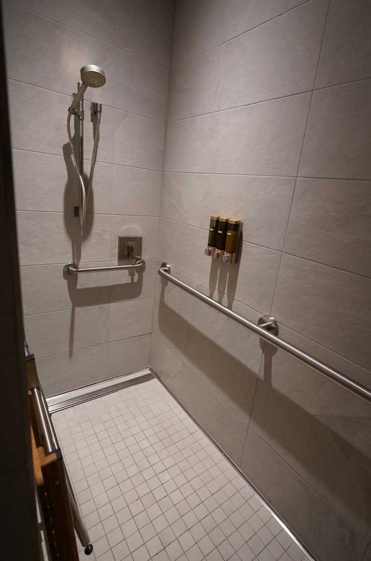 the shower with an accessible seating bench.