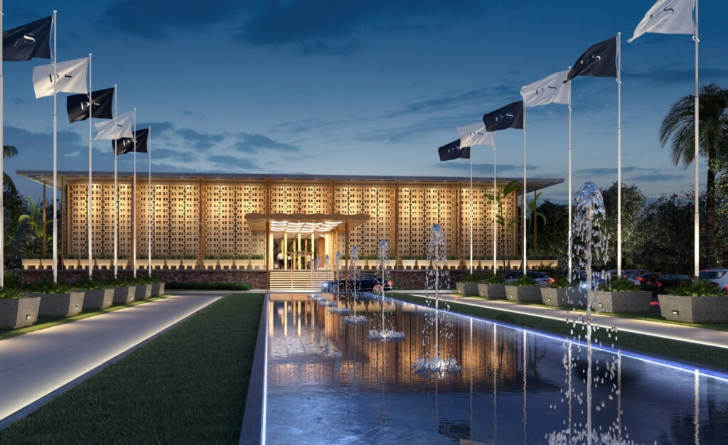 building from the front with water features and PS flags.