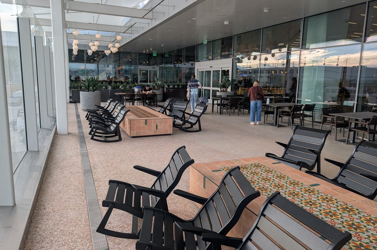 rocking chairs and tables in the background.