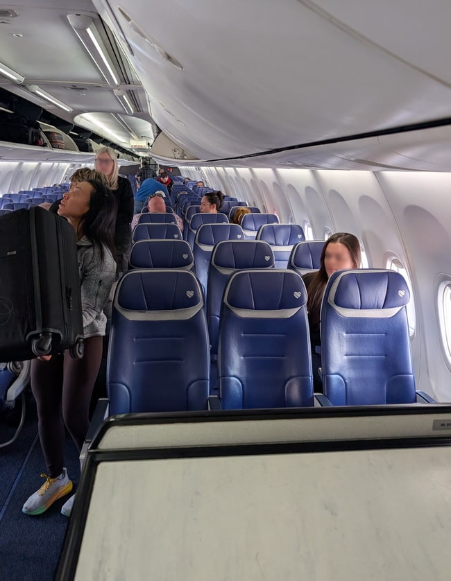 inside the airplane showing Extra Leg Room seats.