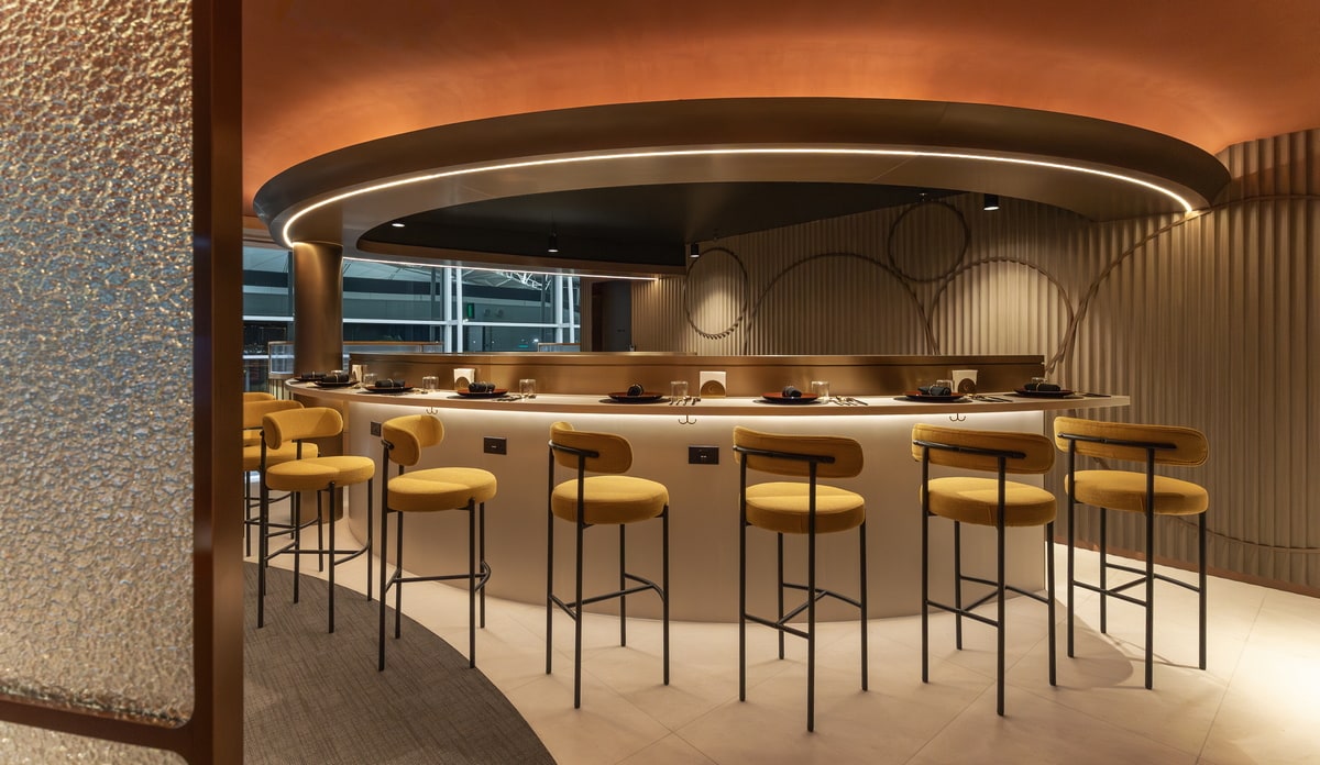 The Counter dining area with seating and table with bar stools.