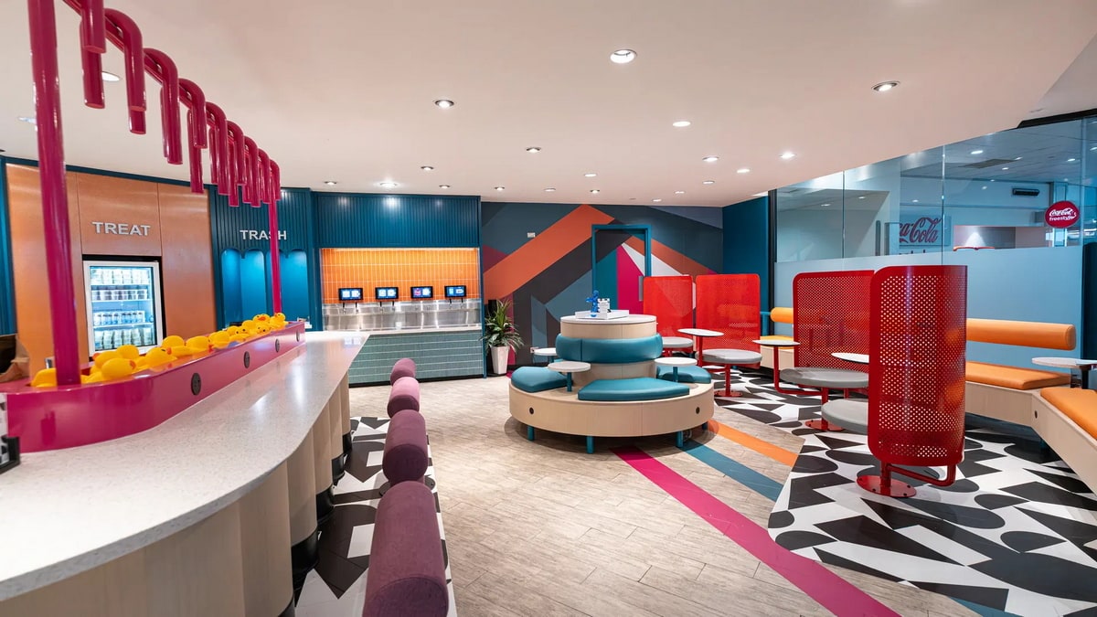 seating area and tables with a self-serve beer bar in the background.