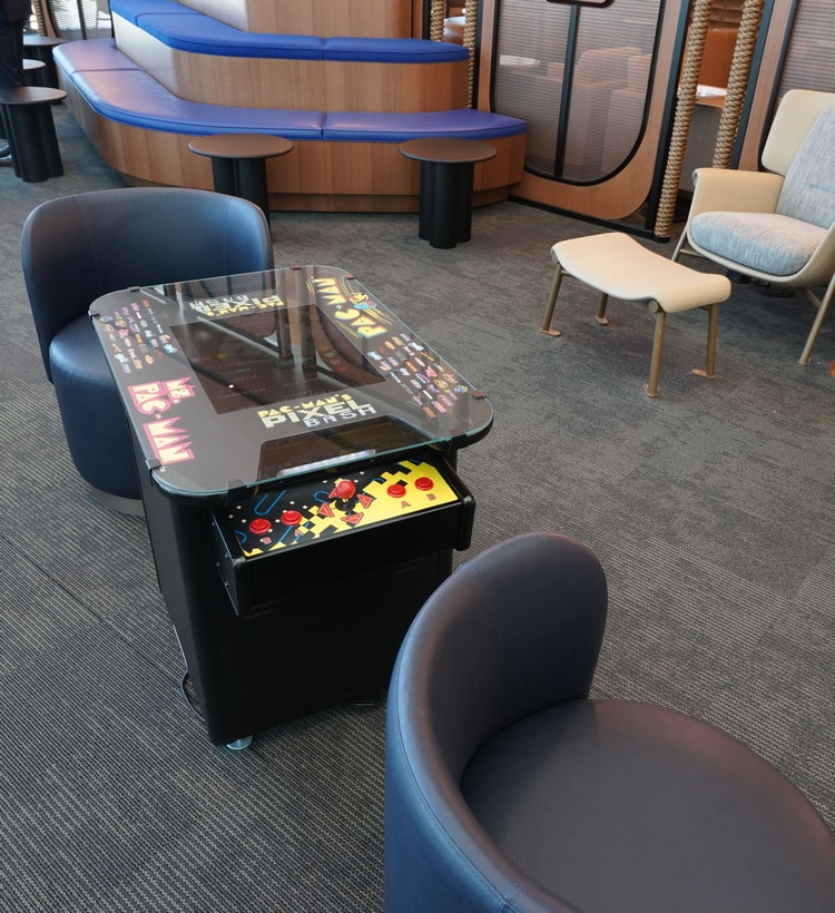 gaming machine with stacked seating.