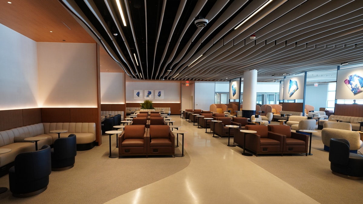 shared seating area with phone booths on the back wall.